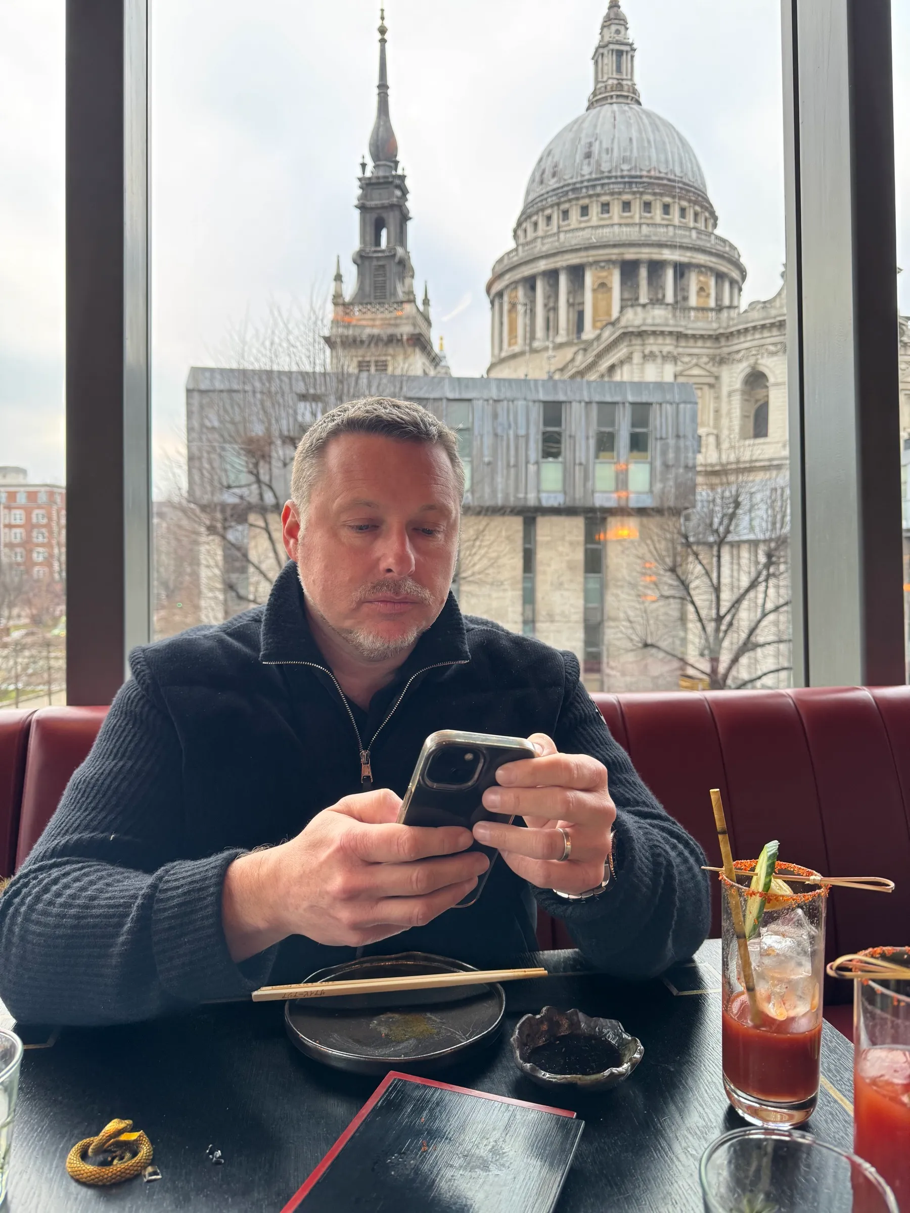 Professional working at a desk overlooking St Paul's Cathedral