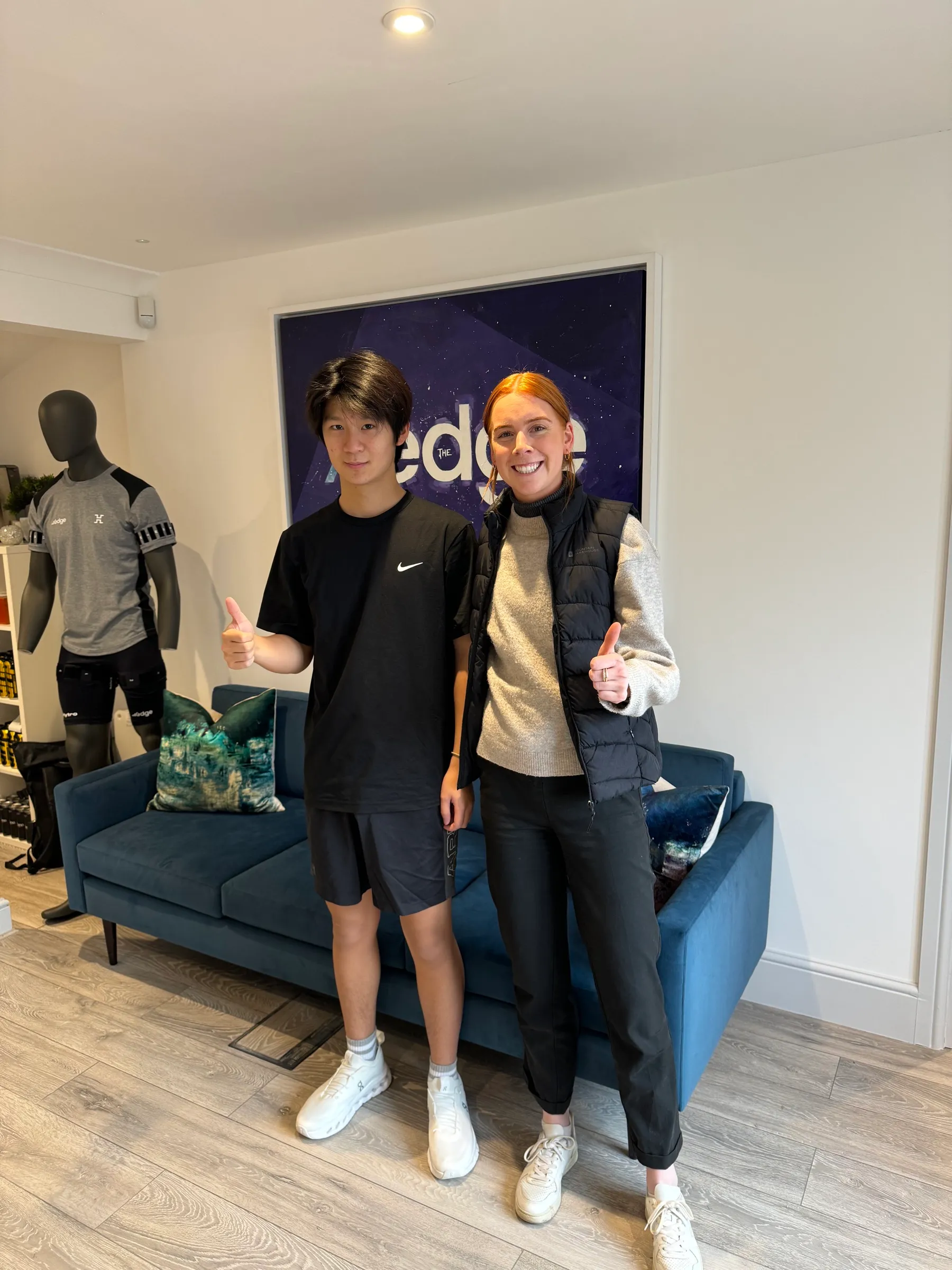 Team in an office lounge after a wellbeing session