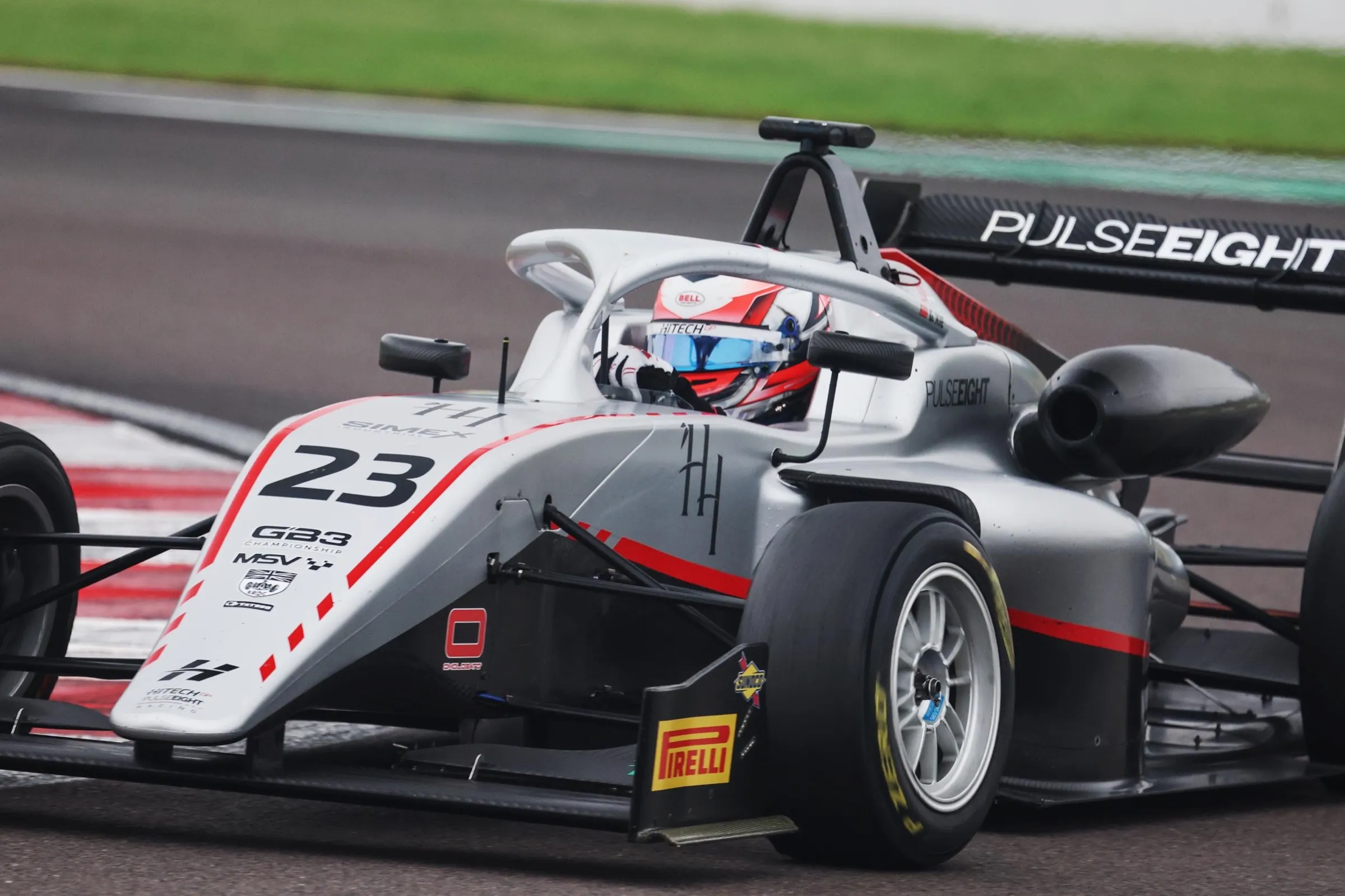F4 car number 23 at speed on track