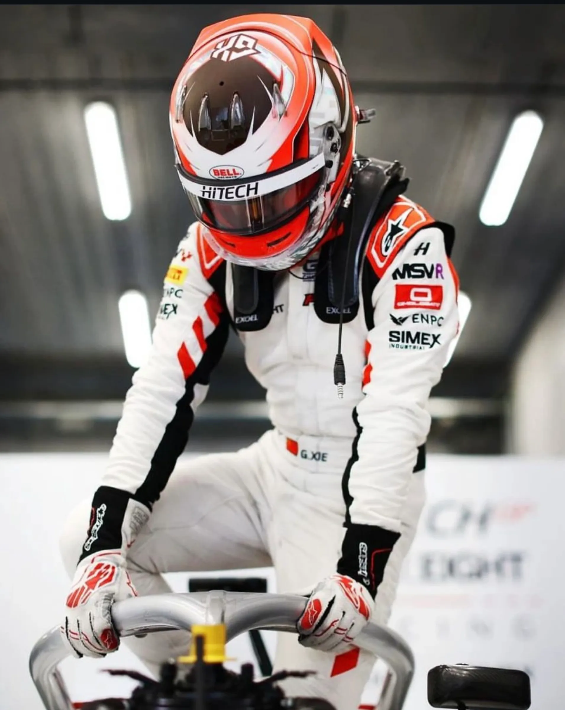Single-seater driver in the garage before a session