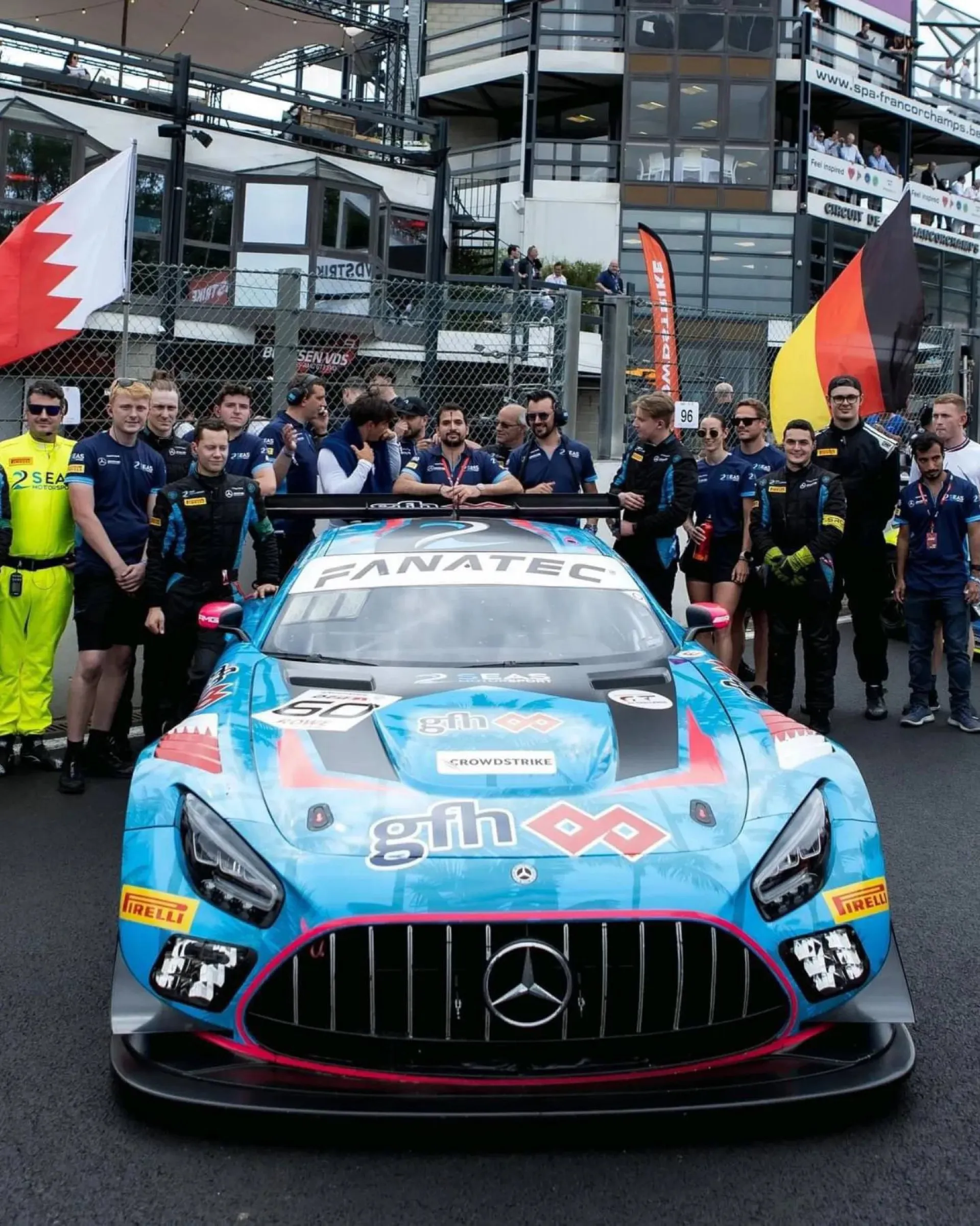 GT3 team photo with the car on the grid