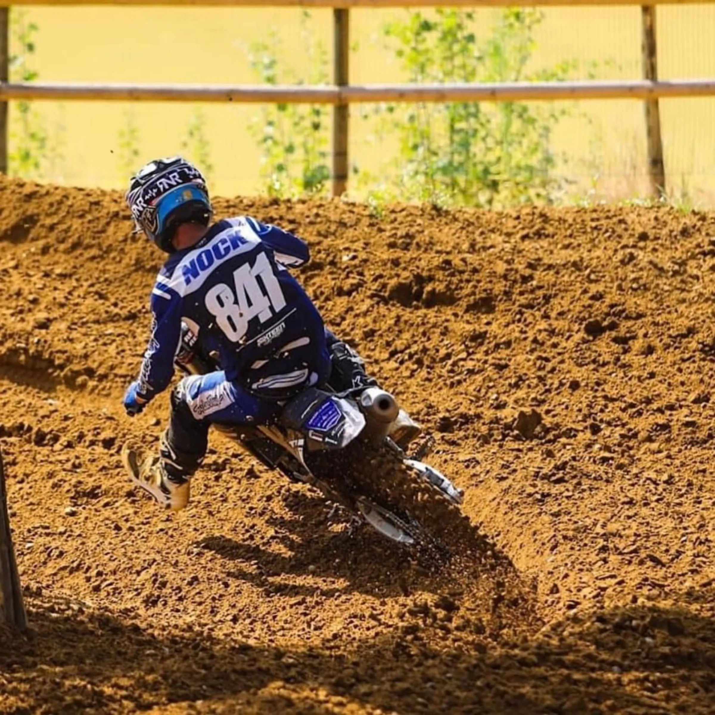 Motocross rider carving a berm